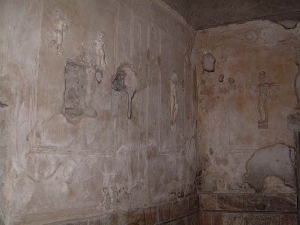 Suburban Baths, Herculaneum, May 2001. Tepidarium, with decorative stucco warriors on white stucco panels set into the walls. Photo courtesy of Current Archaeology.